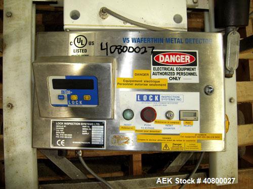 Used Lock Inspection Systems V5 Waferthin Met 30+ Metal Detector, Model Met30-200/+/IP54/286KHZ. Aperture size approximately 8 5/8" diameter x 4" deep. Includes a control panel. Built 2002.