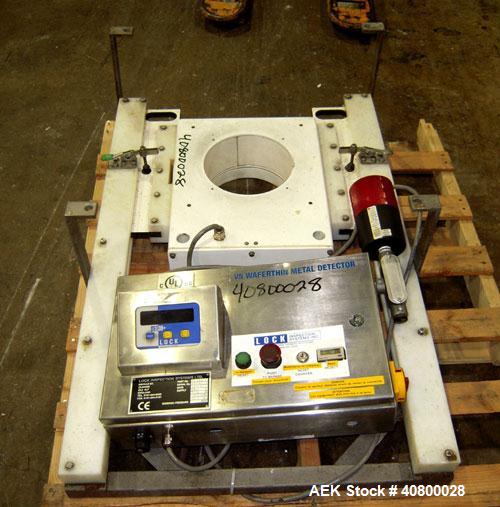 Used Lock Inspection Systems V5 Waferthin Met 30+ Metal Detector, Model Met30-200/+/IP54/286KHZ. Aperture size approximately 8 5/8" diameter x 4" deep. Includes a control panel. Built 2002.