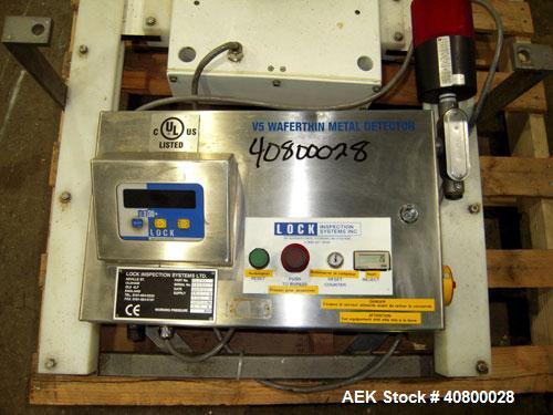 Used Lock Inspection Systems V5 Waferthin Met 30+ Metal Detector, Model Met30-200/+/IP54/286KHZ. Aperture size approximately 8 5/8" diameter x 4" deep. Includes a control panel. Built 2002.