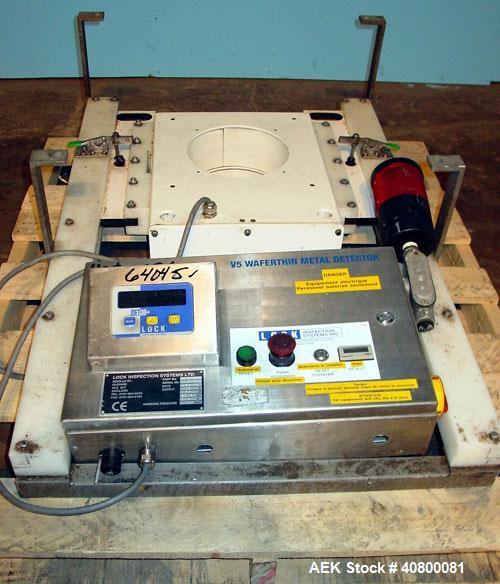 Used Lock Inspection Systems V5 Waferthin Met 30+ Metal Detector, Model Met30-200/+/IP54/286KHZ. Aperture size approximately 8 5/8" diameter x 4" deep. Includes a control panel. Built 2002.