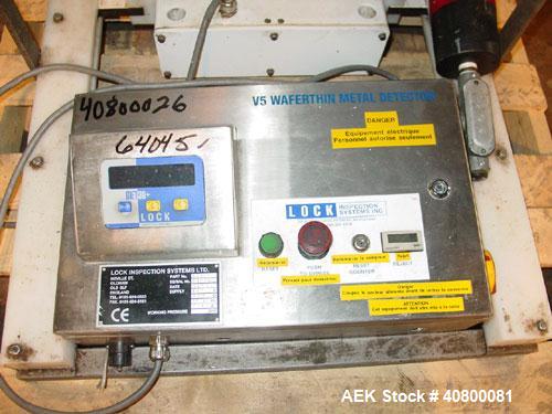 Used Lock Inspection Systems V5 Waferthin Met 30+ Metal Detector, Model Met30-200/+/IP54/286KHZ. Aperture size approximately 8 5/8" diameter x 4" deep. Includes a control panel. Built 2002.