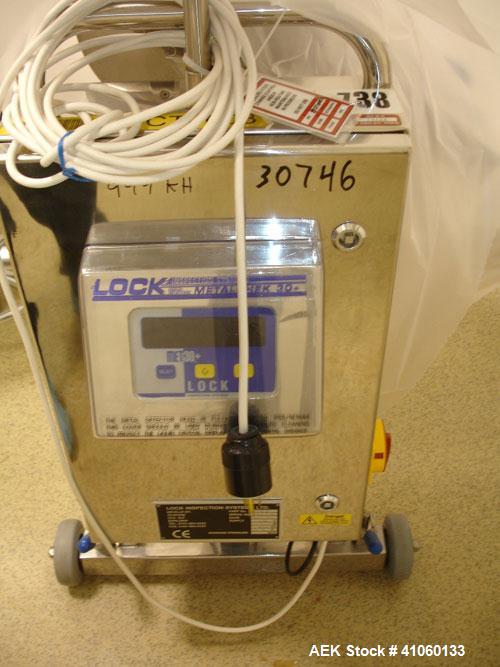 Used Lock Metal Detector, type MET 30+, fall thru design, 3 3/4" wide x 1 3/4" high opening with reject, 115 volt, part #7457, serial #7457/5, new 2001.