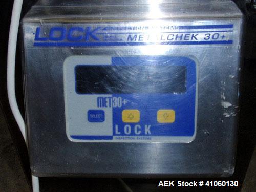 Used Lock Inspection Systems Fall Thru Metal Detector, Model MET 30+ Universal. 3 3/4" wide x 1-3/4" high opening with reject, 115 volt with controls on stand. Capable of 30,000 tablets/capsules per ...