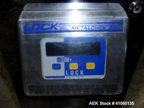 Used Lock Metal Detector, fall thru design, model MET 30+ Universal, serial #5774/1. 3-3/4" wide x 1-3/4" high opening with reject, 115 volt with controls on stand. Capable of 30000 tablets/capsules ...