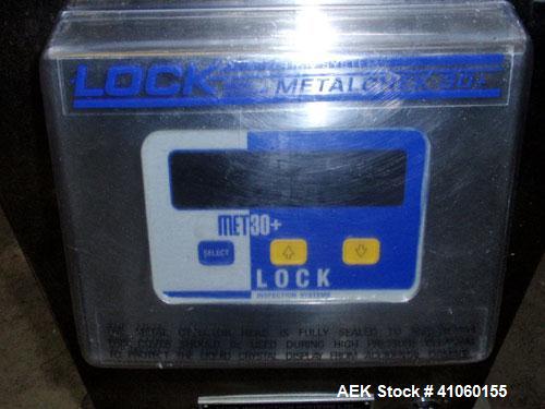 Used Lock Inspection Systems Fall Thru Metal Detector, Model MET 30+ Universal. 3 3/4" wide x 1-3/4" high opening with reject, 115 volt with controls on stand. Capable of 30,000 tablets/capsules per ...