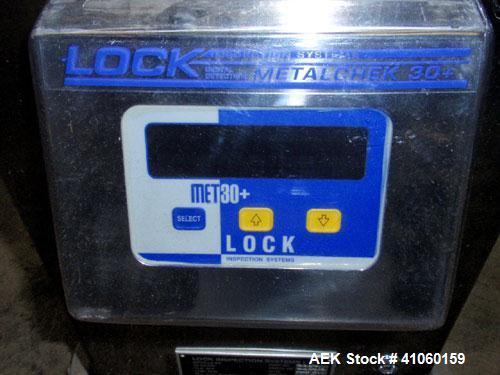 Used Lock Inspection Systems Fall Thru Metal Detector, Model MET 30+ Universal. 3 3/4" wide x 1-3/4" high opening with reject, 115 volt with controls on stand. Capable of 30,000 tablets/capsules per ...