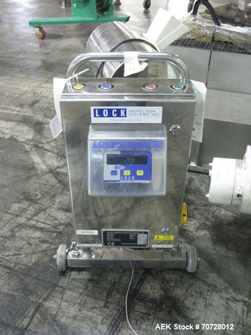 Used Lock Metal Detector, Model MET 30. Part #10579, with reject chute, 4" x 1.5" opening, on stand, 115 V, serial #1057914, built 2002.