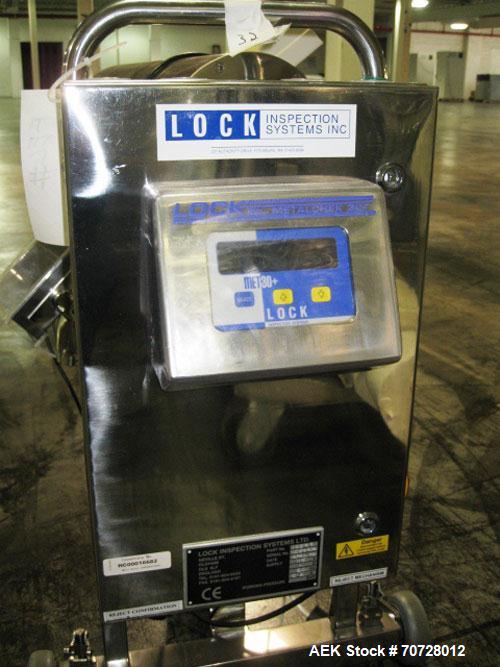 Used Lock Metal Detector, Model MET 30. Part #10579, with reject chute, 4" x 1.5" opening, on stand, 115 V, serial #1057914, built 2002.
