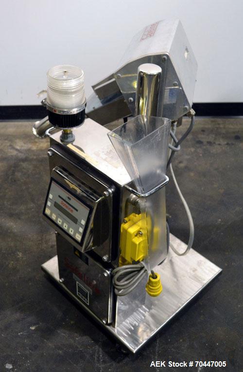 Used Safeline PharmX Tablet/Capsule Metal Detector, Model PHARMXS/76X38/V2/600/RC, Stainless Steel. Approximate aperture 1.3’’ tall x 3.7’’ wide. Rated up to 10,000 tablets per minute. Mounted on a s...