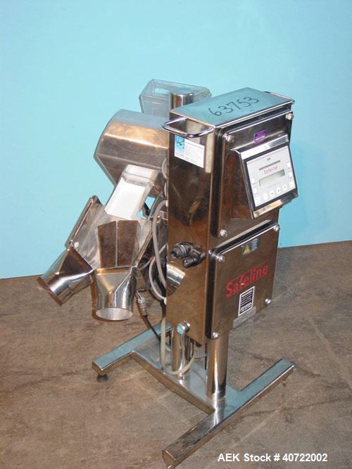 Used Safeline Drop Though Metal Detector, model Tablex 600KHz. 3 1/2" wide x 1" high aperture, 4 1/2" x 6" plastic chute infeed. Dual discharge with swinging reject diverter. Mounted on a stainless s...