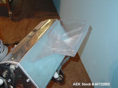 Used Safeline Drop Though Metal Detector, model Tablex 600KHz. 3 1/2" wide x 1" high aperture, 4 1/2" x 6" plastic chute infeed. Dual discharge with swinging reject diverter. Mounted on a stainless s...