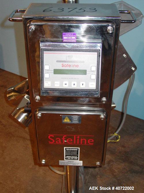 Used Safeline Drop Though Metal Detector, model Tablex 600KHz. 3 1/2" wide x 1" high aperture, 4 1/2" x 6" plastic chute infeed. Dual discharge with swinging reject diverter. Mounted on a stainless s...
