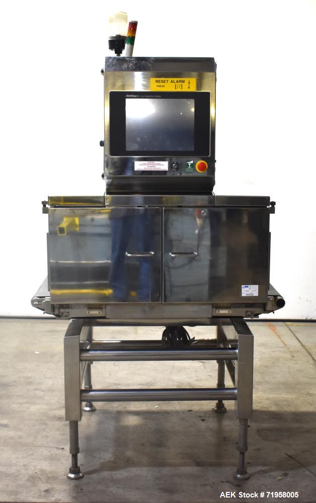 Used Anritsu X-Ray Inspection System, Model KD74. Approximate 27-1/2" W x 14" H product opening with approximate 24-1/2" W belt. Product weight maximum 50kg / 110 lbs. (35m/min). Product size maximum...
