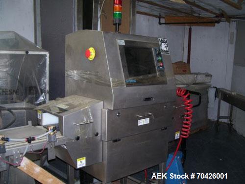 Used Smiths Heimann Eagle Bantam MK2 X-Ray Inspection System with reject system. 9" Wide x 4" tall opening. Manufactured 2005.