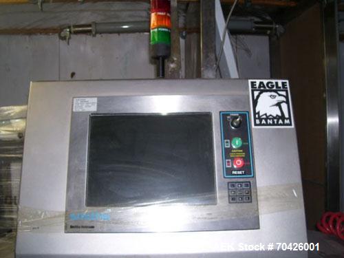 Used Smiths Heimann Eagle Bantam MK2 X-Ray Inspection System with reject system. 9" Wide x 4" tall opening. Manufactured 2005.