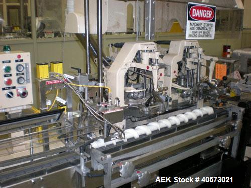Used: Lakso model 71 automatic twin head cottoner capable of speeds up to 200 BPM. Has screw infeed automatic bottle .Has factory controls, "Steel It" pharmaceutical grade finish on all non-stainless...