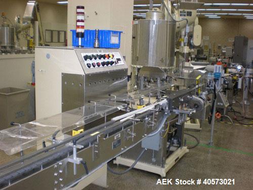 Used: Lakso model 71 automatic twin head cottoner capable of speeds up to 200 BPM. Has screw infeed automatic bottle .Has factory controls, "Steel It" pharmaceutical grade finish on all non-stainless...