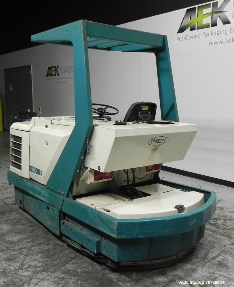 Used Tennant Model 528 SRS Edition Riding Floor Scrubber. Has a 4-cycle propane powered engine. Has 122 gallon solution tank and 4.9 gallon cleaning solution tank. Has (1) 11" and (1) 13" scrub brush...