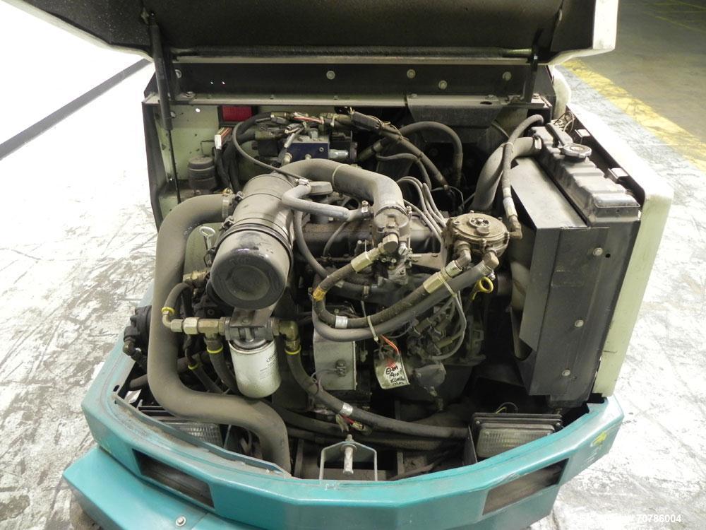 Used Tennant Model 528 SRS Edition Riding Floor Scrubber. Has a 4-cycle propane powered engine. Has 122 gallon solution tank and 4.9 gallon cleaning solution tank. Has (1) 11" and (1) 13" scrub brush...