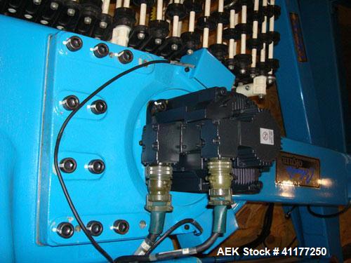 Used Columbia Okura 4 Axis Robotic Style Full Case or Bag Palletizer, Model A730. Capable of speeds up to 550 CPH or 700 BPH. Load capacity: rated 176 lb or 80 Kg, max 260 lb or 120 Kg. Has AB PLC co...