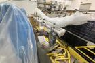 Used Fanuc Robotic Palletizing System, Model M710/M20. Palletizer consists of: (1) Fanuc LR-Mate 7L articulating robot, (1) Fanuc R-100IC articulating robot, (1) factor equipment sleeving device, (1)...
