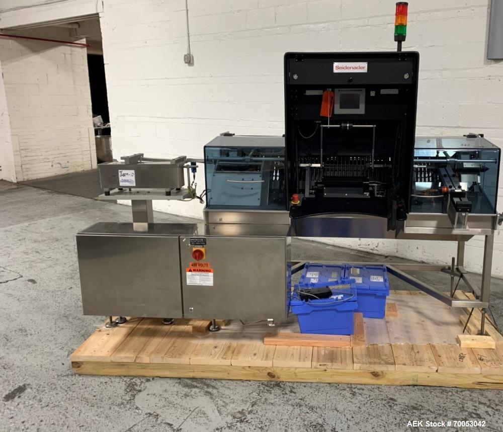 Used Unused Seidenader inspection system, with (2) type V90-AVSB/60 Seidenader semi automatic inspection units, (1) L-R unit, (1) R-L unit, currently set up for syringe inspection, with Sortec feedin...
