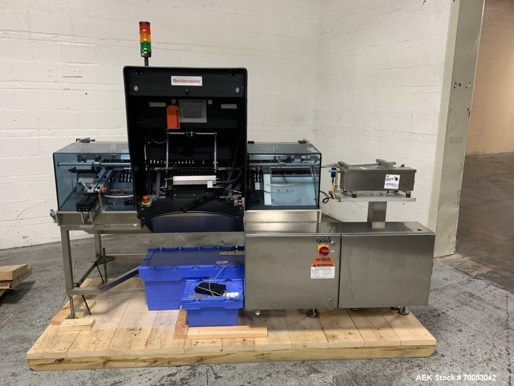 Used Unused Seidenader inspection system, with (2) type V90-AVSB/60 Seidenader semi automatic inspection units, (1) L-R unit, (1) R-L unit, currently set up for syringe inspection, with Sortec feedin...