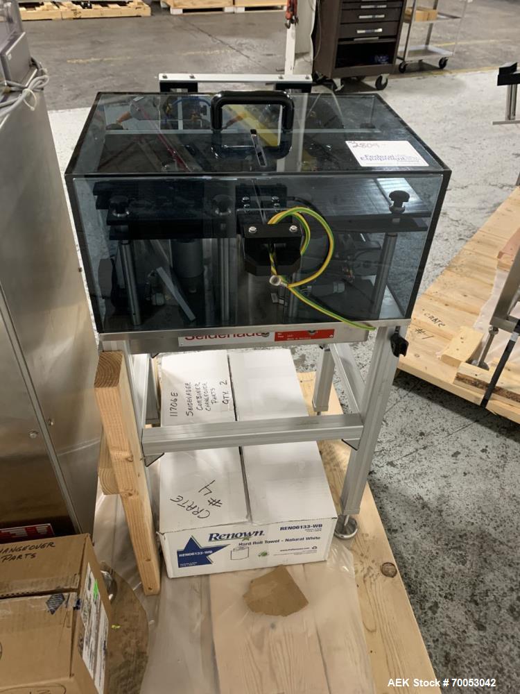 Used Unused Seidenader inspection system, with (2) type V90-AVSB/60 Seidenader semi automatic inspection units, (1) L-R unit, (1) R-L unit, currently set up for syringe inspection, with Sortec feedin...