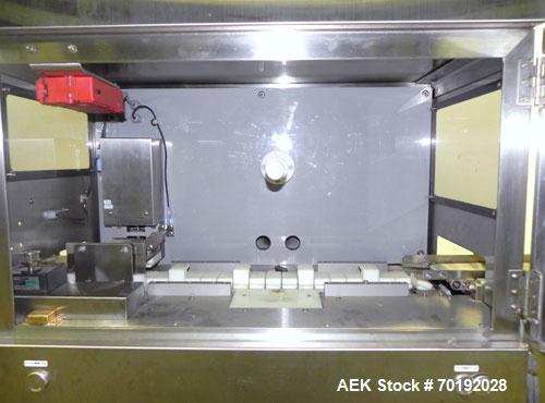 Used Nikka Densok Model HD1-1S High Voltage Pharmaceutical Pin Hole Detection System. Set for plastic vials and capable of speeds up to 300 vials per minute. Has a max card size: 150mm wide x 110mm t...