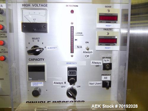 Used Nikka Densok Model HD1-1S High Voltage Pharmaceutical Pin Hole Detection System. Set for plastic vials and capable of speeds up to 300 vials per minute. Has a max card size: 150mm wide x 110mm t...