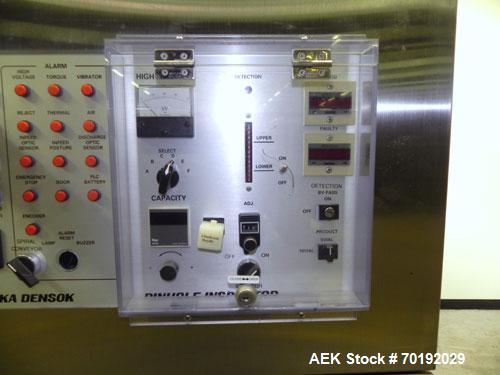 Used Nikka Densok Model HD1-1S High Voltage Pharmaceutical Pin Hole Detection System. Set for plastic vials and capable of speeds up to 300 vials per minute. Has a max card size: 150mm wide x 110mm t...
