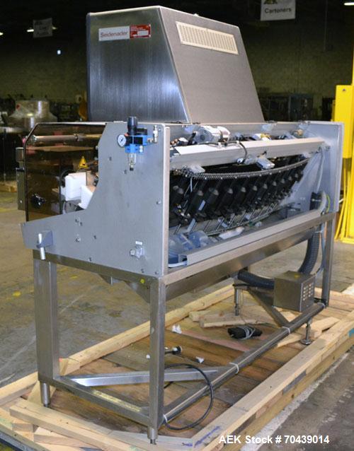 Used Seidenader V90 AVSB for visual inspection of filled vials. Model V90-AVSB/60-LR can handle products from .5ml to 1000ml with changeparts. Currently set up for 200ml vials. Can handle clear solut...