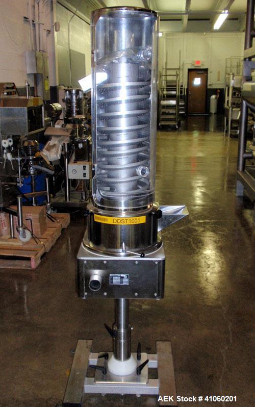 Used Kramer Tablet Deduster, Model E2000-500 IR. Approximate capacity 60,000 to 3,000,000 capsules per hour depending on size. Maximum tablet 25mm. 110-240 volt, 50/60 hz. Includes a C810 control pan...