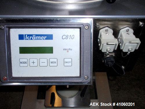 Used Kramer Tablet Deduster, Model E2000-500 IR. Approximate capacity 60,000 to 3,000,000 capsules per hour depending on size. Maximum tablet 25mm. 110-240 volt, 50/60 hz. Includes a C810 control pan...