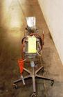 Used Key International Tablet Deduster, Model TD-101, 304 Stainless Steel. Air volume 1 to 2 cfm, vacuum 20 to 30, nozzle for dust control. Mounted on stand with casters.