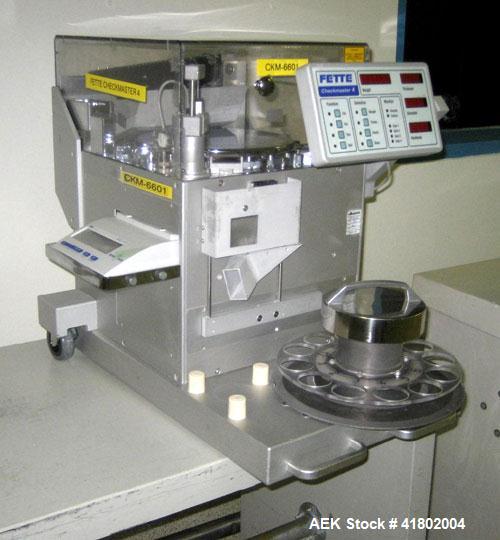 Used Fette Compacting Complex Tablet Monitoring Machine, Model Checkmaster 4. Designed to measure weight, hardness, thickness, and diameter in-process. Measurement functions range: Weight 0.01-50 G, ...