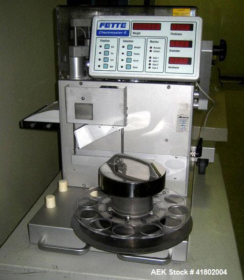 Used Fette Compacting Complex Tablet Monitoring Machine, Model Checkmaster 4. Designed to measure weight, hardness, thickness, and diameter in-process. Measurement functions range: Weight 0.01-50 G, ...