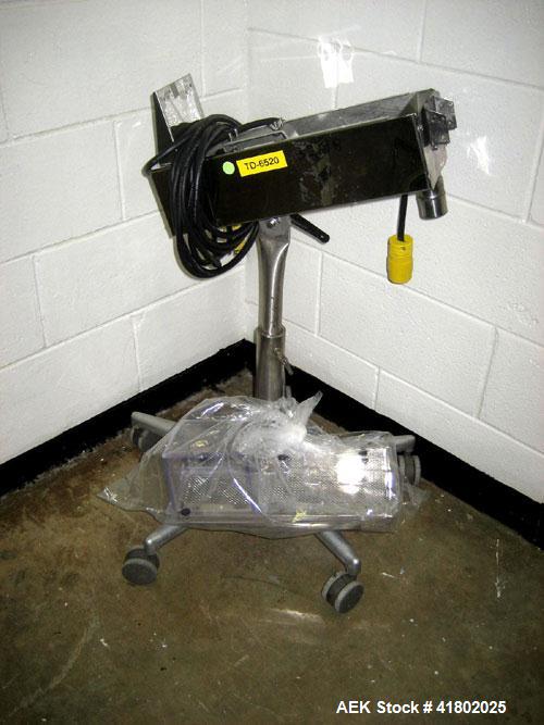 Used Key International Tablet Deduster, Model TD-101, 304 Stainless Steel. Air volume 1 to 2 cfm, vacuum 20 to 30 cfm. 115 volt. Mounted on stand with casters.