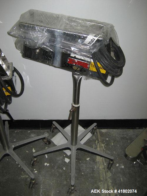 Used Key International Tablet Deduster, Model TD-101, 304 Stainless Steel. Air volume 1 to 2 cfm, vacuum 20 to 30 cfm. 115 volt. Mounted on stand with casters.