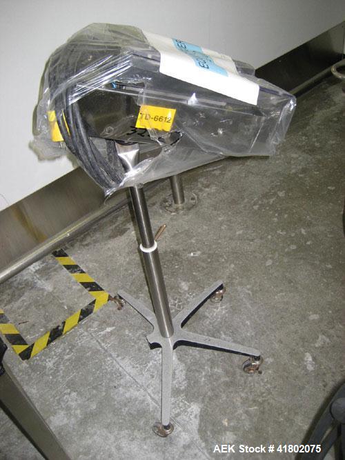 Used Key International Tablet Deduster, Model TD-101, 304 Stainless Steel. Air volume 1 to 2 cfm, vacuum 20 to 30 cfm. 115 volt. Mounted on stand with casters.