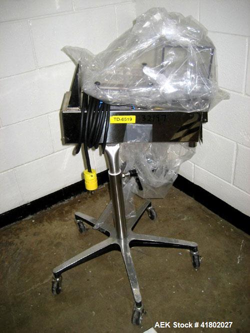 Used Key International Tablet Deduster, Model TD-101, 304 Stainless Steel. Air volume 1 to 2 cfm, vacuum 20 to 30 cfm. 115 volt. Mounted on stand with casters.