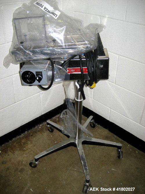 Used Key International Tablet Deduster, Model TD-101, 304 Stainless Steel. Air volume 1 to 2 cfm, vacuum 20 to 30 cfm. 115 volt. Mounted on stand with casters.