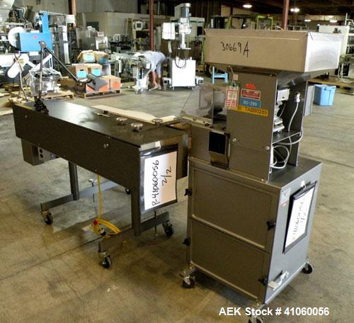 Used Lakso QA Inspection Table Consisting Of: (1) Lakso model 64 feeder, consisting of (1) feed hopper, approximate 1850 cubic inch capacity, (1) Eriez Magnetics model 0 variable speed vibrating sift...