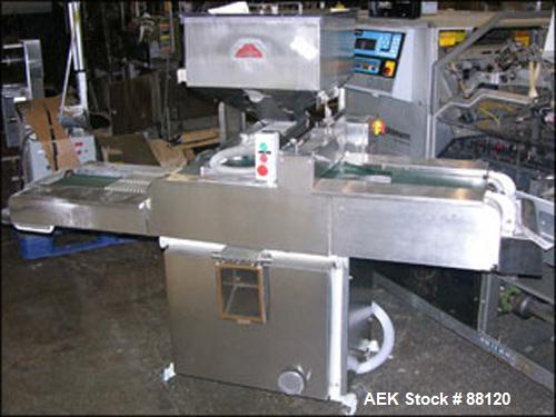Used Lakso Tablet Inspection Belt. 12" wide with hopper and feeder. Mounted on a stand.