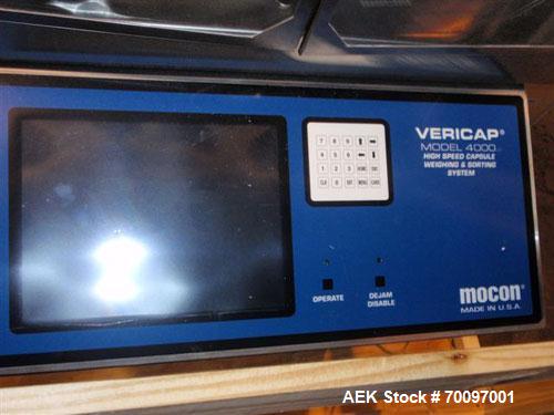 Used Mocon Vericap 4000 High Speed Capsule Checkweighing and Sorting System. Capable of speeds up to 132,000 capsules per hour. Can handle capsule sizes 00, 1, 2, 3 and 4 with proper changeparts. Bui...