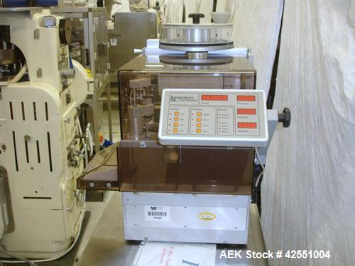 Used Kraemer Elektronik Universal Testing Machine, Model UTS. Fully automatic testing of the parameters weight, thickness, diameter and hardness. Rotary tablet table with Mettler Toledo scale. 90-264...
