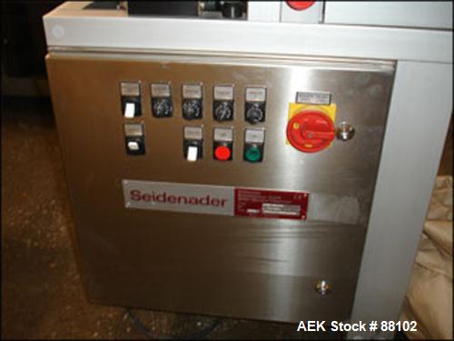 Used Seidenader Inspection Belt, Model V50-2-LR. 8" Long roller, feeder rated up to 100,000 capsules per hour or up to 50 kg tablets per hour. 6 kw, 110 volt, on base.