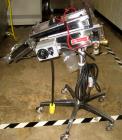 Used Key International Tablet Deduster, Model TD-101, 304 Stainless Steel. Air volume 1 to 2 cfm, vacuum 20 to 30 cfm. 115 volt. Mounted on stand with casters.