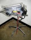 Used Key International Tablet Deduster, Model TD-101, 304 Stainless Steel. Air volume 1 to 2 cfm, vacuum 20 to 30 cfm. 115 volt. Mounted on stand with casters.