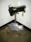 Used Key International Tablet Deduster, Model TD-101, 304 Stainless Steel. Air volume 1 to 2 cfm, vacuum 20 to 30 cfm. 115 volt. Mounted on stand with casters.